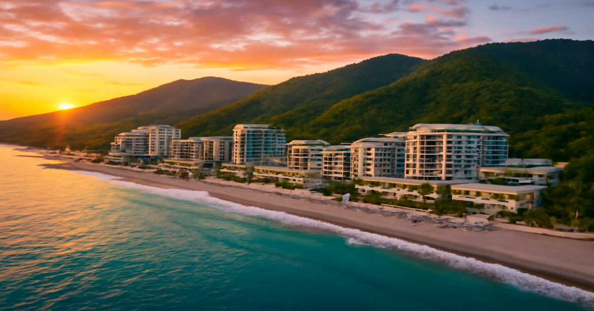Aerial view of hotels in Sochi by the sea, showcasing the beauty of the coastline and mountains.